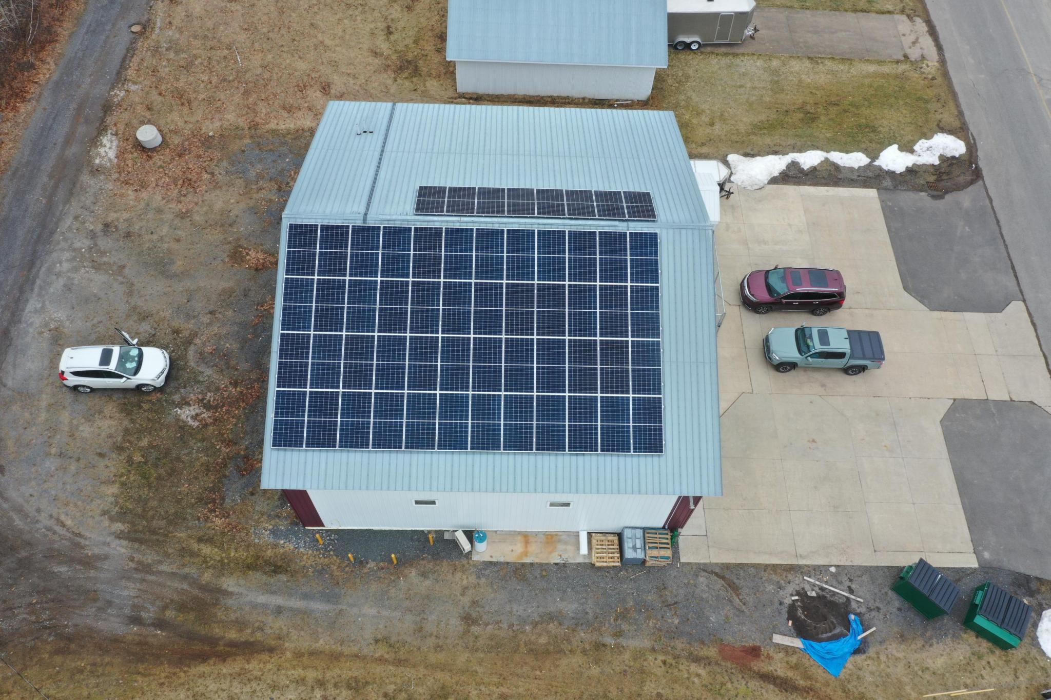 Commercial rooftop solar panel installation on a Nova Scotia metal roof