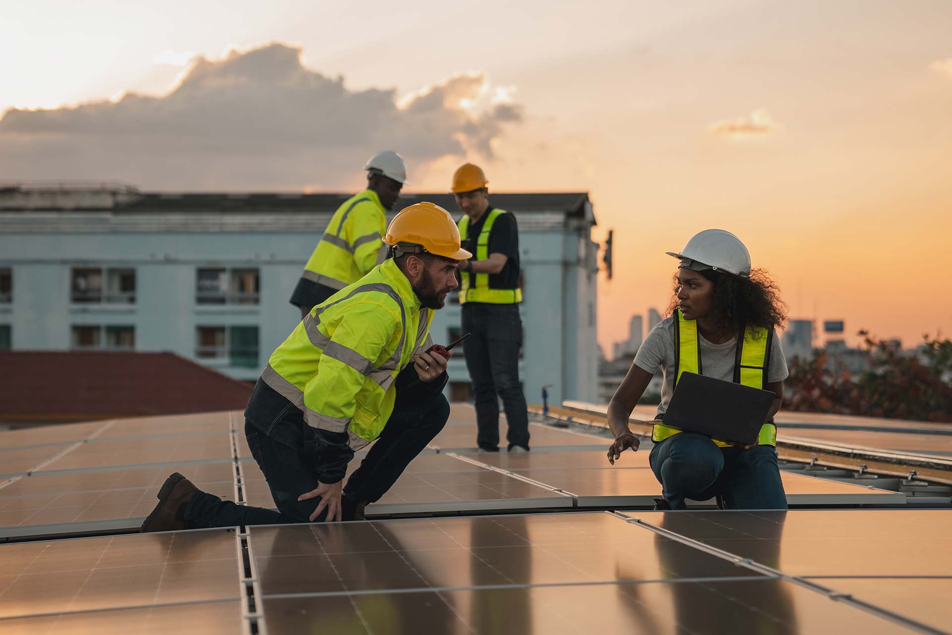 OYO Energy technicians inspecting rooftop solar panels in Nova Scotia