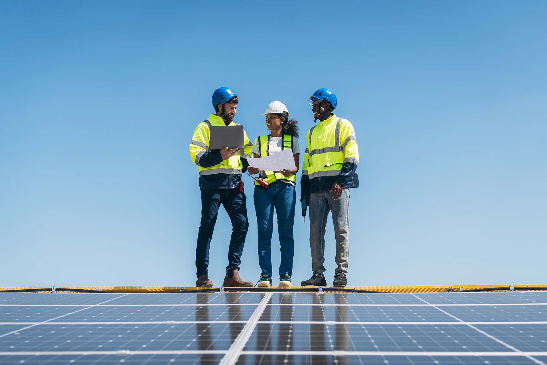 OYO Energy technicians reviewing a solar installation plan in Nova Scotia